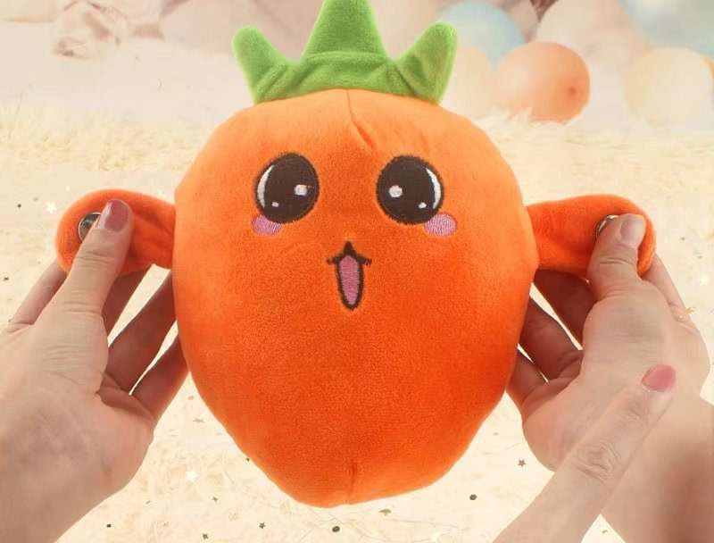 Carrot plush held with both touch buttons